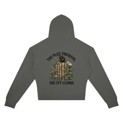Women’s cropped drop-shoulder hoodie with a black cat on ivy-covered books, The Plot Thickens, The Ivy Climbs back print