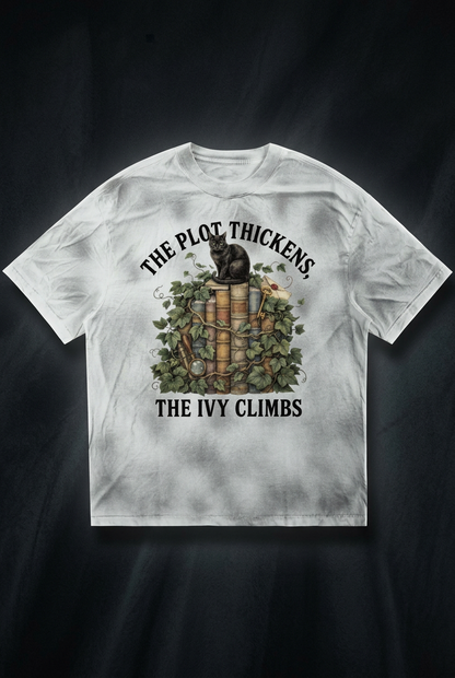 Women’s dirty-washed loose tee with a black cat on ivy-covered books, The Plot Thickens, The Ivy Climbs front print