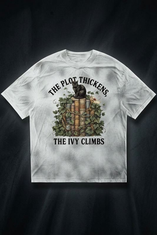 Women’s dirty-washed loose tee with a black cat on ivy-covered books, The Plot Thickens, The Ivy Climbs front print