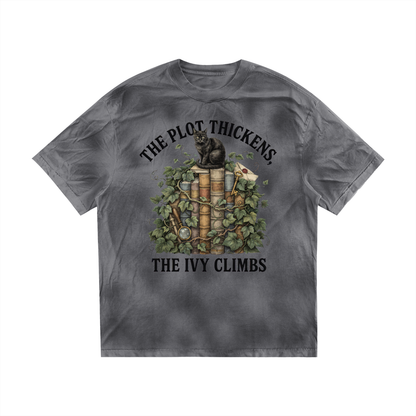 Women’s dirty-washed loose tee with a black cat on ivy-covered books, The Plot Thickens, The Ivy Climbs front print