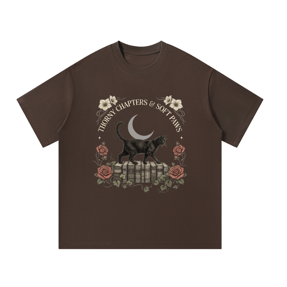 Unisex oversized heavyweight cotton tee with a black cat walking over old books under a crescent moon, Thorny Chapters & Soft Paws front print