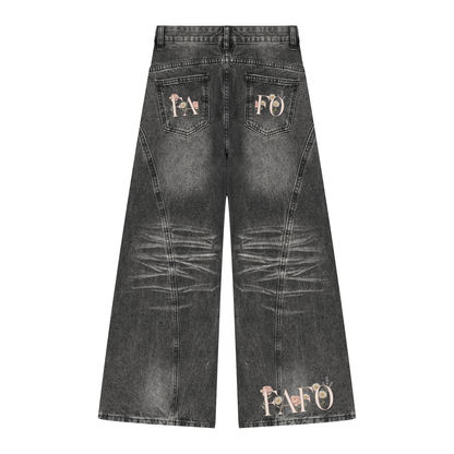 Back of black vintage wash wide leg jeans with FAFO lettering on the back pockets and across the back hem