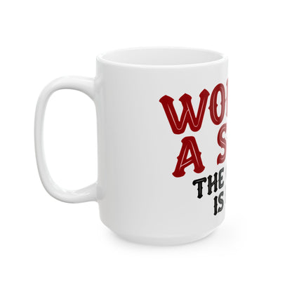 Funny coffee mug printed with "WORK IS A SCAM / THE COFFEE IS REAL", 15 oz size, left side view
